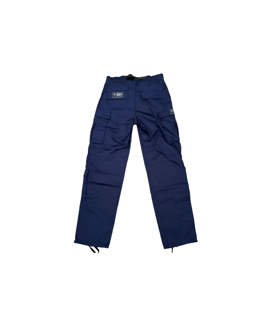 Kup oryginalne Corteiz Guerillaz Cargo Pants Navy CORT-COGCPN-NAVY - widok z drugiego boku - Sneakersy